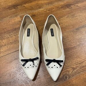 Nine West flats, size 8, cream with a back bow, okay condition